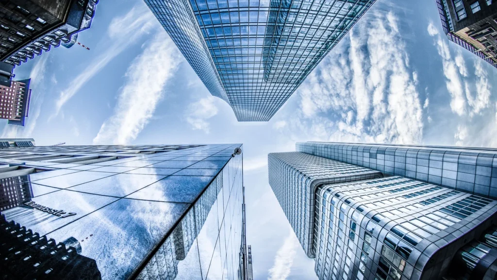 Low-angle view of modern glass skyscrapers in Frankfurt's financial district.