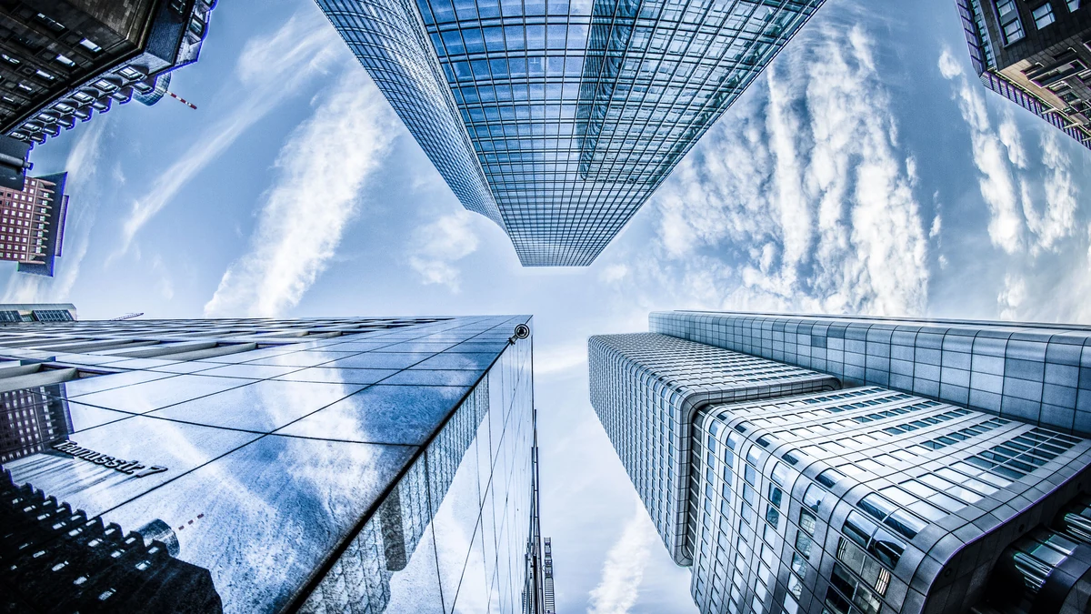Low-angle view of modern glass skyscrapers in Frankfurt's financial district.