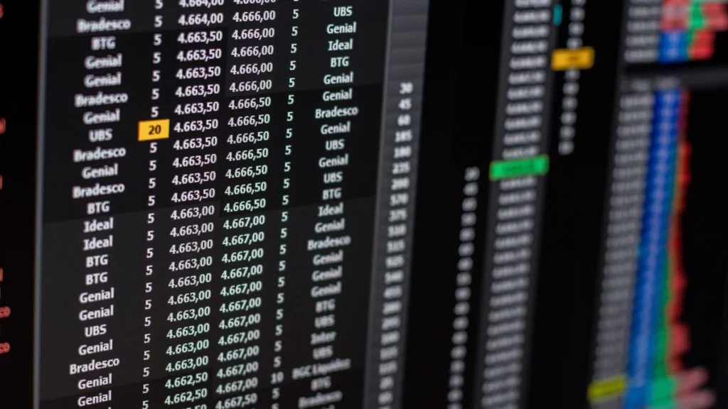 Close-up of a financial market display showing stock prices and trading data.