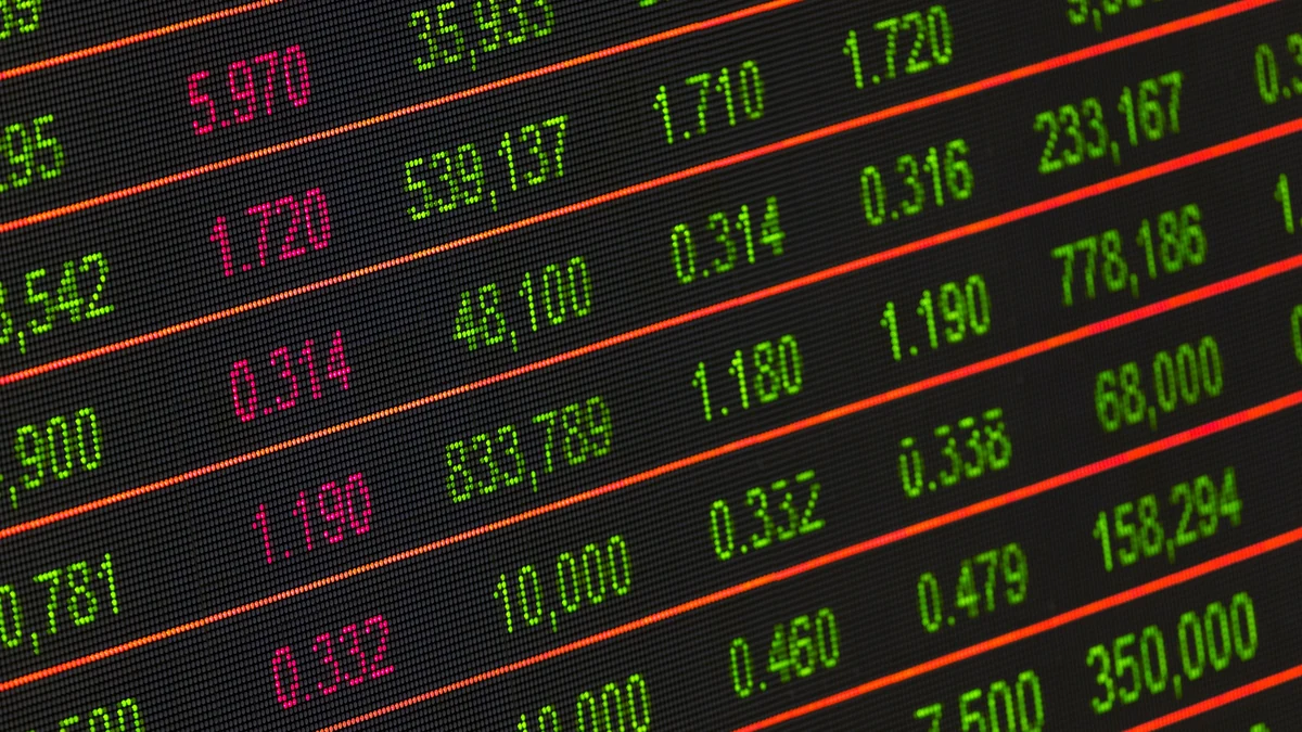 Close-up of a stock market data board with green and red financial figures.