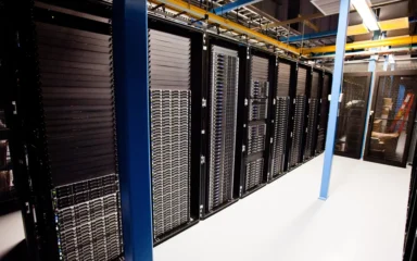 Rows of server racks inside a Wikimedia data center.