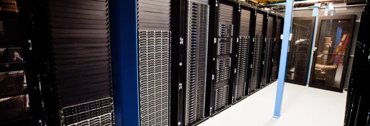 Rows of server racks inside a Wikimedia data center.