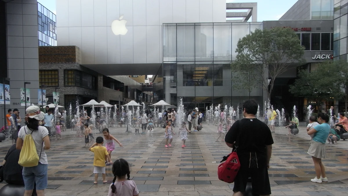 Apple Store in Beijing's Sanlitun district with an Apple logo above an outdoor plaza.