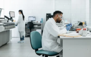 Researchers analyzing samples in a modern medical laboratory.