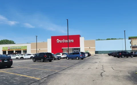 A Burlington store in Villa Park, Illinois, with a red Burlington storefront sign and a parking lot in front.