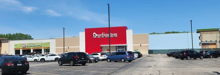 A Burlington store in Villa Park, Illinois, with a red Burlington storefront sign and a parking lot in front.