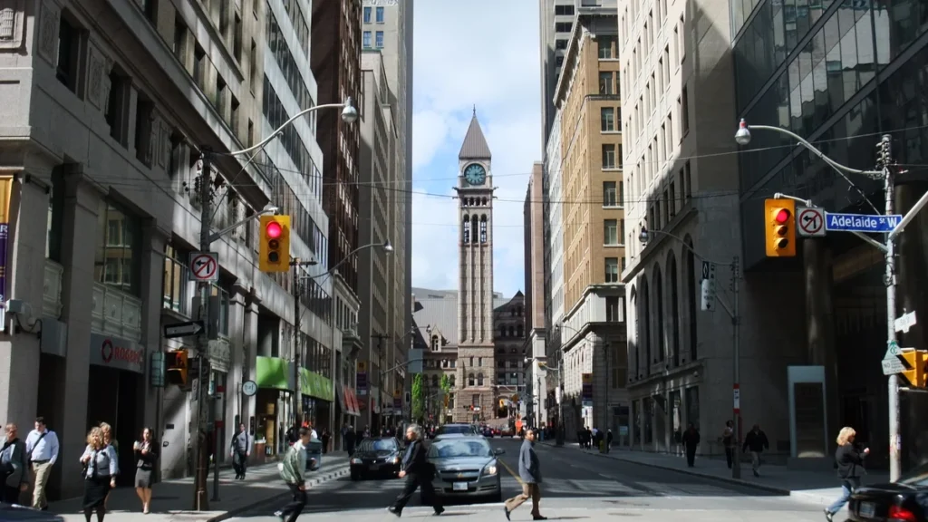 Bay Street in Toronto’s Financial District, lined with office and retail buildings.