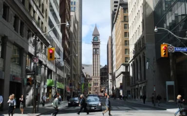 Bay Street in Toronto’s Financial District, lined with office and retail buildings.