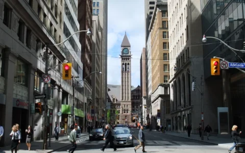 Bay Street in Toronto’s Financial District, lined with office and retail buildings.