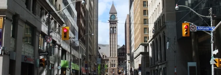Bay Street in Toronto’s Financial District, lined with office and retail buildings.