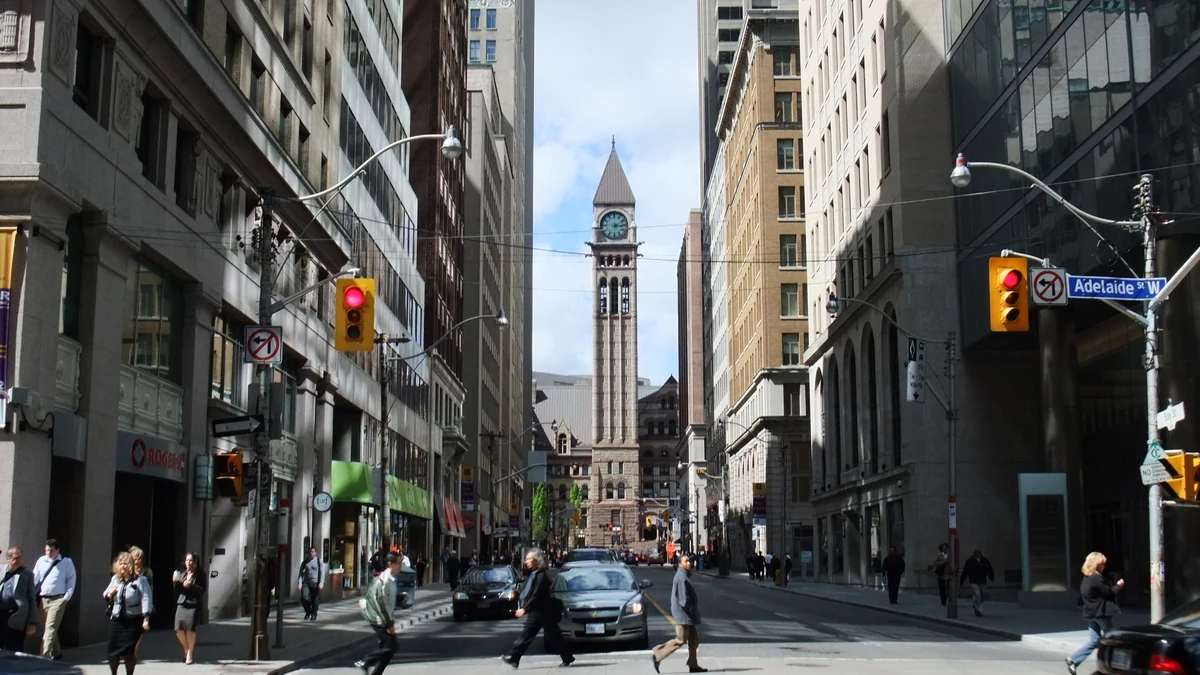 Bay Street in Toronto’s Financial District, lined with office and retail buildings.