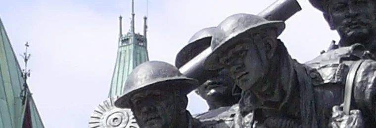 National War Memorial sculpture with the Peace Tower on Parliament Hill in Ottawa.