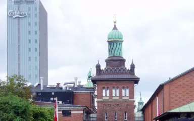 Historic Carlsberg brewery buildings and the Elephant Gate tower in Copenhagen.