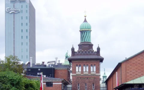 Historic Carlsberg brewery buildings and the Elephant Gate tower in Copenhagen.