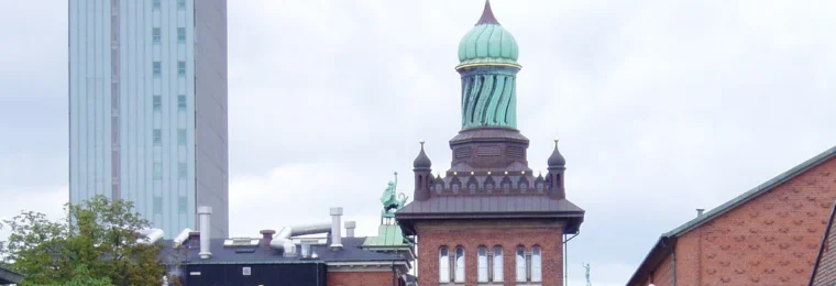 Historic Carlsberg brewery buildings and the Elephant Gate tower in Copenhagen.