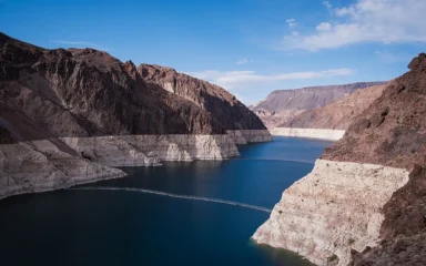 Lake Mead in Black Canyon with a white bathtub ring marking lower water levels near Hoover Dam.