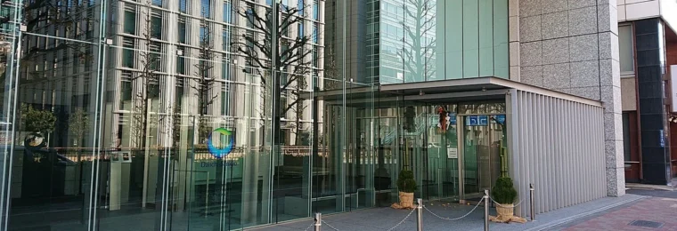 Entrance of the Daiichi Sankyo Nihonbashi Building in Tokyo with the street visible in front.