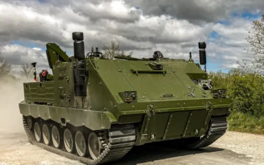 FFG ACSV G5 tracked armored vehicle driving on a dirt road.