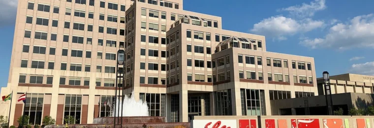 Eli Lilly Corporate Center in Indianapolis with Lilly signage in the foreground.