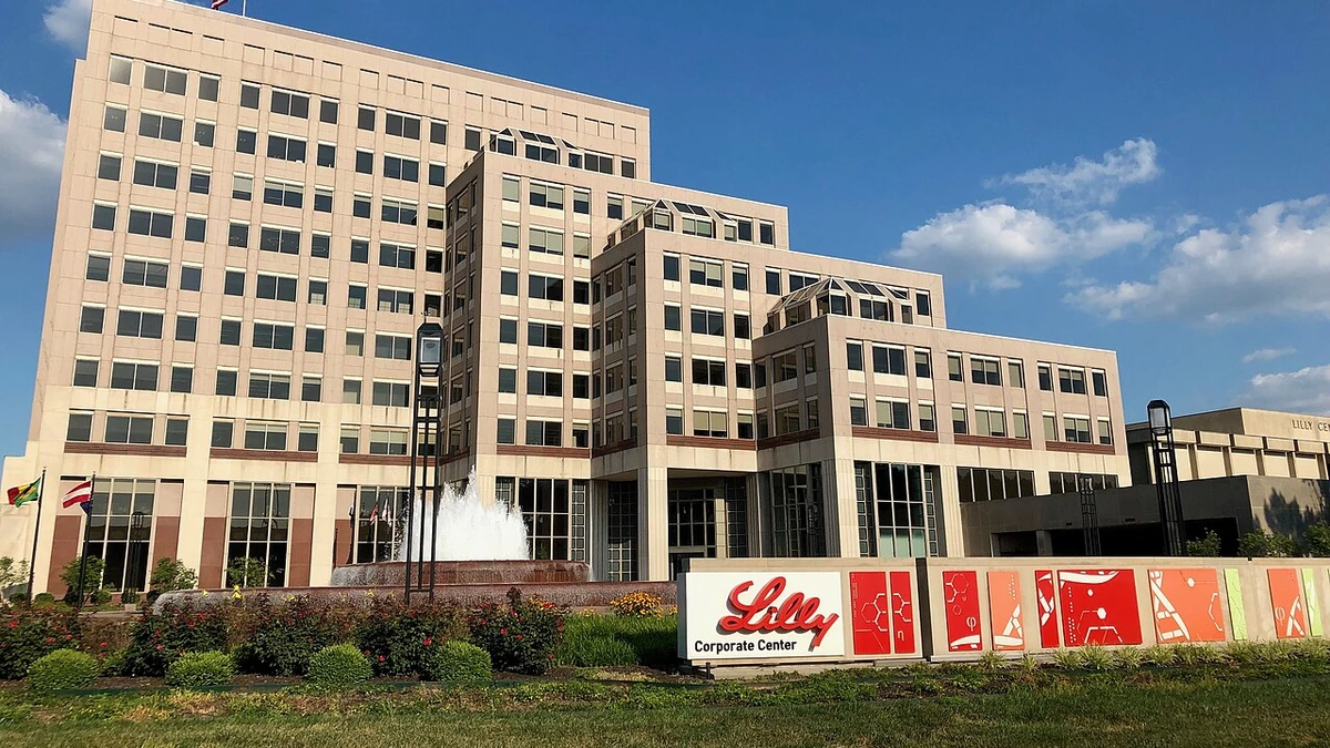Eli Lilly Corporate Center in Indianapolis with Lilly signage in the foreground.