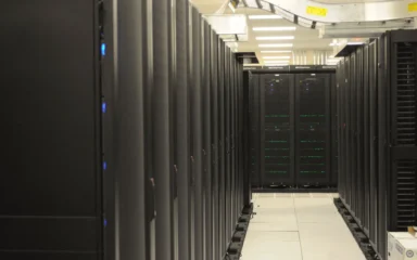 Rows of server racks inside the National Energy Research Scientific Computing Center.