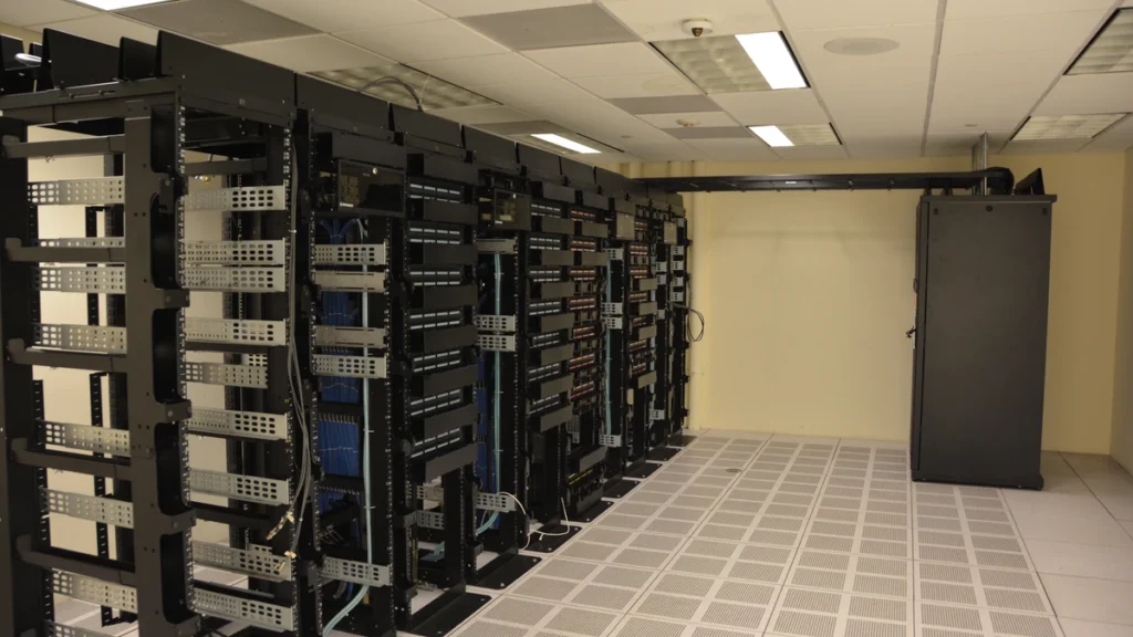 Rows of server racks inside a data center.