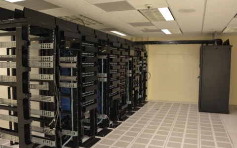 Rows of server racks inside a data center.