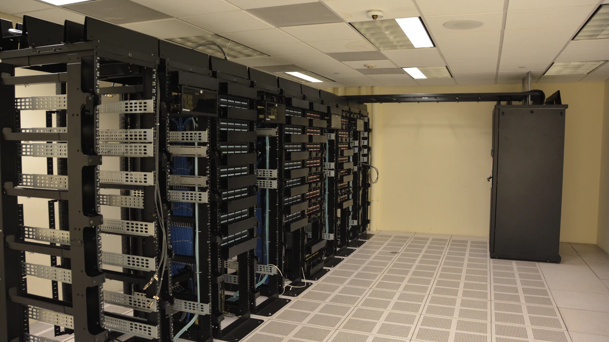 Rows of server racks inside a data center.