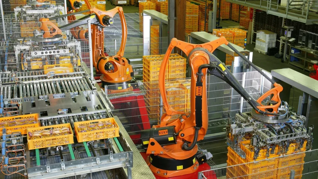 Industrial robots working on an automated production line at a bakery in Germany.