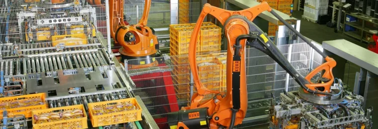 Industrial robots working on an automated production line at a bakery in Germany.