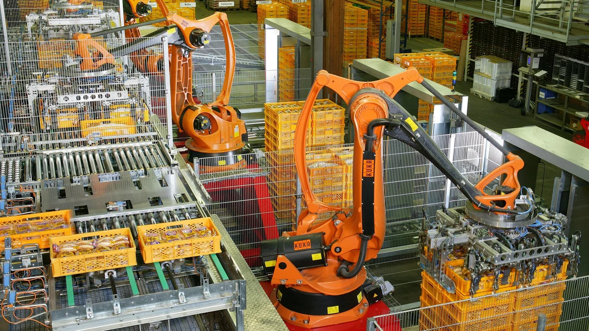 Industrial robots working on an automated production line at a bakery in Germany.