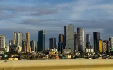 Mumbai skyline with high-rise buildings along the city waterfront.
