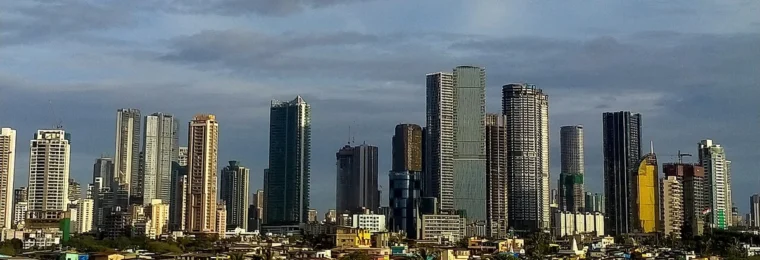 Mumbai skyline with high-rise buildings along the city waterfront.