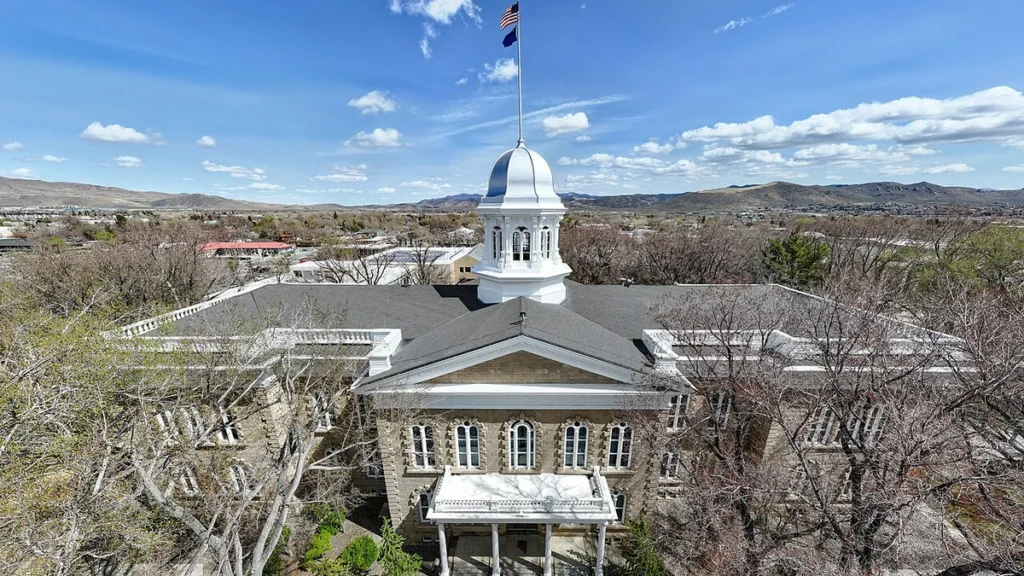 Nevada State Capitol building in Carson City beneath a blue sky.