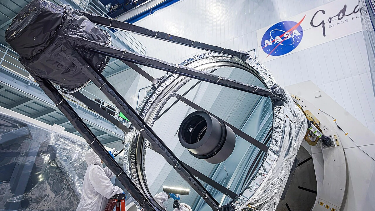 Optical engineer Bente Eegholm inspects the 2.4-meter primary mirror for NASA’s Nancy Grace Roman Space Telescope.