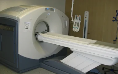 GE Discovery D600 PET/CT scanner in a medical imaging room.