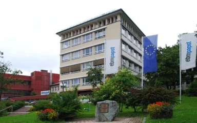 ebm-papst facility with company flags in St. Georgen im Schwarzwald, Germany.