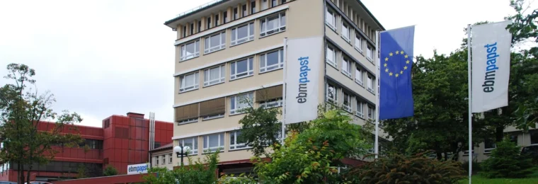 ebm-papst facility with company flags in St. Georgen im Schwarzwald, Germany.