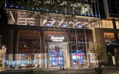 Marriott International headquarters entrance in Bethesda, Maryland, illuminated at night.