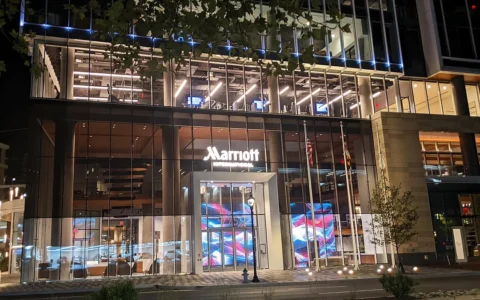 Marriott International headquarters entrance in Bethesda, Maryland, illuminated at night.