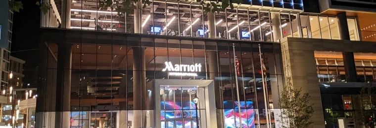 Marriott International headquarters entrance in Bethesda, Maryland, illuminated at night.