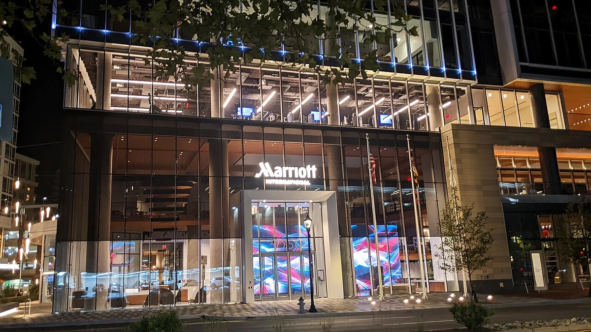 Marriott International headquarters entrance in Bethesda, Maryland, illuminated at night.