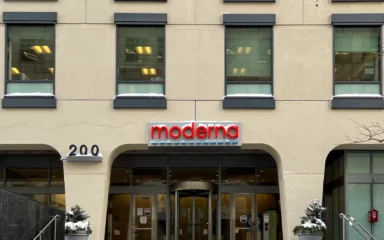 Moderna office building entrance in Cambridge, Massachusetts, with the Moderna sign above the doors.