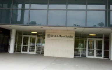 Entrance to a Bristol-Myers Squibb building in New Jersey with company signage.