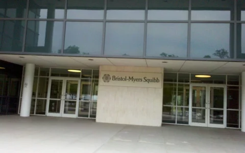 Entrance to a Bristol-Myers Squibb building in New Jersey with company signage.