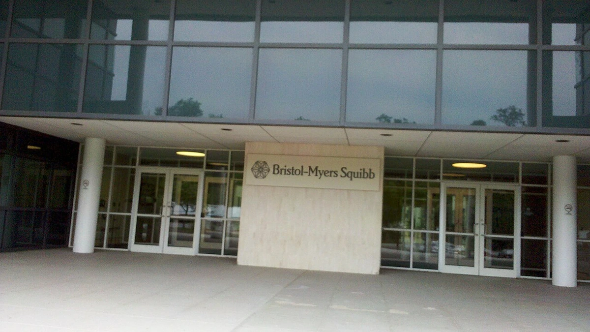 Entrance to a Bristol-Myers Squibb building in New Jersey with company signage.