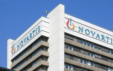 Novartis headquarters building in Basel, Switzerland, with Novartis signage.