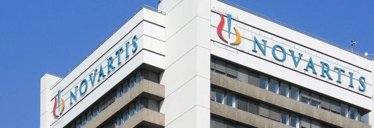 Novartis headquarters building in Basel, Switzerland, with Novartis signage.