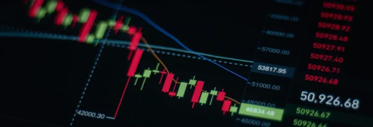 Close-up of a stock market chart with red and green candlesticks on a digital screen.