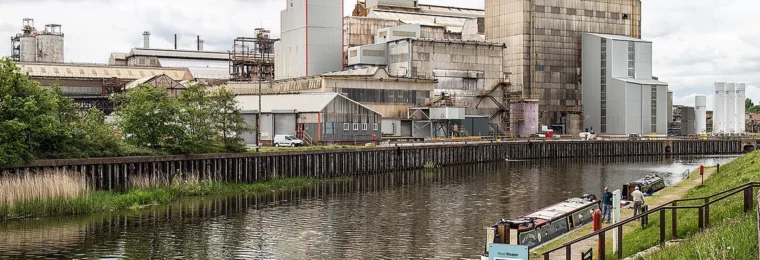 Industrial buildings at the Tata Chemicals Winnington plant beside a waterway in Northwich, England.